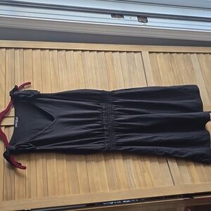 Black cotton dress with bows on shoulders